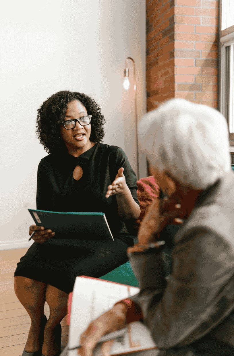 A lady giving advice to older lady