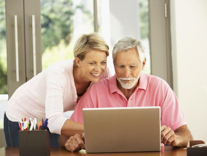 Older couple looking at laptop