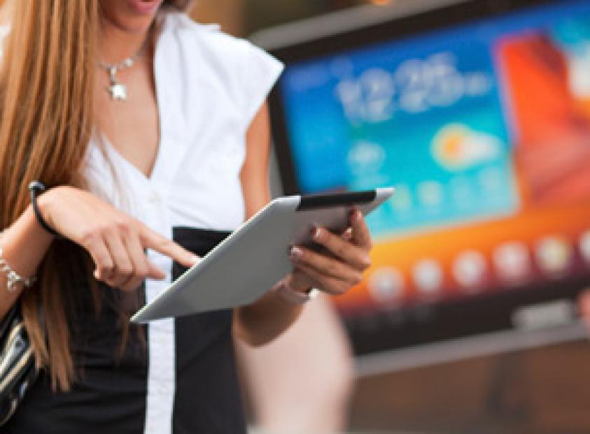 image of a woman using a handheld device