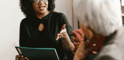 A lady giving advice to older lady